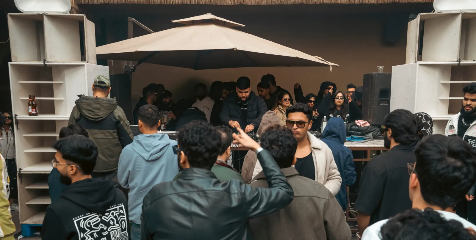 The crowd gathered under the canopy at a day party